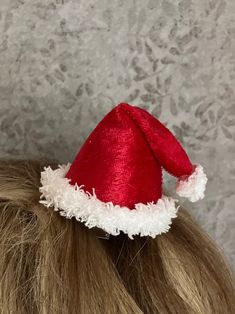 "My handcrafted mini Santa Hat is easy to either clip into hair or add to your plastic or metal headband for quick, holiday charm. Available in either traditional red or festive green, the hat is made from panne \"velvet\" and fur-like trim.  It's lightweight and compact.  Enjoy wearing your seasonal hat without worry about traditional holiday \"hat hair\" once it's removed!   Choose the attachment device that works best for you:  an alligator clip or a slide-thru casing (this allows you to slid Red Adjustable Holiday Hat, Adjustable Red Christmas Hat, Red Adjustable Christmas Hat, Adjustable Red Mini Hat For Christmas, Red Adjustable Mini Hat For Christmas, Red Novelty Adjustable Costume Hats And Headpieces, Red Adjustable Novelty Costume Hats And Headpieces, Adjustable Red Mini Hat For Holidays, Adjustable Red Mini Christmas Hats