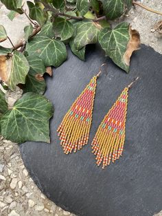 Geometric gold pink beadwork earrings Pink Fringe beaded earrings Stylish earrings Seed bead Boho earrings Modern earrings Short Dangle ♥𝑇ℎ𝑒 𝑝𝑎𝑡𝑡𝑒𝑟𝑛 𝑜𝑓 𝑡ℎ𝑖𝑠 𝑒𝑎𝑟𝑟𝑖𝑛𝑔 𝑖𝑠 𝑐𝑟𝑒𝑎𝑡𝑒𝑑 𝑏𝑦 𝐾𝑎𝑍𝑒𝐵𝑒𝑎𝑑𝐽𝑒𝑤𝑒𝑙𝑟𝑦 ♥𝑀𝑎𝑑𝑒 𝑢𝑠𝑖𝑛𝑔 𝑓𝑟𝑒𝑒ℎ𝑎𝑛𝑑 𝑏𝑒𝑎𝑑𝑖𝑛𝑔 𝑤𝑜𝑣𝑒𝑛 𝑡𝑒𝑐ℎ𝑛𝑖𝑞𝑢𝑒𝑠 𝑤𝑖𝑡ℎ 𝑠𝑡𝑟𝑜𝑛𝑔 𝑠𝑦𝑛𝑡ℎ𝑒𝑡𝑖𝑐 𝑡ℎ𝑟𝑒𝑎𝑑. ♥𝑇ℎ𝑒 𝑠𝑖𝑧𝑒 𝑜𝑓 𝑡ℎ𝑒 𝑠𝑒𝑒𝑑 𝑏𝑒𝑎𝑑𝑠 𝑢𝑠𝑒𝑑 𝑖𝑠 2 𝑚𝑖𝑙𝑙𝑖𝑚𝑒𝑡𝑒𝑟𝑠 𝑎𝑛𝑑 𝑏𝑒𝑎𝑑𝑠 𝑎𝑟𝑒 ℎ𝑖𝑔ℎ 𝑞𝑢𝑎𝑙𝑖𝑓𝑖𝑒𝑑. ♥𝐴𝑙𝑙 𝑡ℎ𝑒 ℎ𝑜𝑜𝑘𝑠 𝑢𝑠𝑒𝑑 𝑖𝑛 𝑜𝑢𝑟 𝑗𝑒𝑤𝑒𝑙𝑟𝑦 𝑎𝑟𝑒 24 𝑘 𝑔𝑜𝑙𝑑 𝑝𝑙𝑎𝑡𝑒𝑑 𝑎𝑛𝑑 ℎ𝑦𝑝𝑜𝑎𝑙𝑙𝑒𝑟𝑔𝑒𝑛𝑖𝑐. ♥𝑇ℎ𝑒𝑠𝑒 𝑎𝑟𝑒 𝑣𝑒𝑟𝑦 𝑙𝑖𝑔ℎ𝑡 𝑒𝑎𝑟𝑟𝑖𝑛𝑔𝑠 𝑡ℎ𝑎𝑡 𝑦𝑜𝑢 𝑐𝑎𝑛 𝑤𝑒𝑎𝑟 𝑎𝑙𝑙 𝑑𝑎𝑦 𝑤𝑖𝑡ℎ𝑜𝑢𝑡 ℎ𝑢𝑟𝑡𝑖𝑛𝑔 𝑦𝑜𝑢𝑟 𝑒𝑎𝑟! The only a Pink Bohemian Beaded Earrings, Multicolor Round Beads Earrings With Gold Beads, Gold Tiny Beaded Dangle Earrings, Gold Beaded Dangling Earrings For Festival, Gold Dangle Earrings With Tiny Beads, Multicolor Beaded Earrings With Gold Beads As Gift, Pink Small Beads Earrings For Festival, Pink Beaded Earrings With Dangling Beads For Festivals, Bohemian Pink Beaded Earrings With Tiny Beads