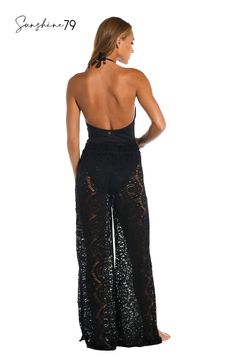 With a breezy boho vibe, these sophisticated palazzo pants from Sunshine 79 offer the crocheted look you've been searching for. Pull on over your favorite swimsuit for a chic cover-up or pair with a cami for an elevated look that's completely effortless. A waist tie finished with gold logo cord ends offers an adjustable fit. [split] Details Beach pants Adjustable waist tie Gold logo cord ends Wide, palazzo-style legs Fabric 100% Cotton Bohemian Fitted Tie-side Bottoms, Fitted Bohemian Tie-side Bottoms, Black Summer Bottoms For Beach Cover-up, Chic Full Length Wide Leg Beach Pants, Bohemian Stretch Bottoms For Beach, Beachy Summer Party Bottoms, Lace Beach Bottoms For Summer, Fitted Beachy Bottoms For Beach Cover-up, Bohemian Bottoms For Beach Party In Spring