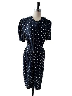 "Vintage Ms Chaus Blue and White Polka Dot button up dress size 10/12 Button up front.  This one has front pockets! Measurements laying flat:  Bust: approximately 19\" across Waist 18\"  Hips:  up to 20\" Top of neckline to bottom of dress: 44\" Brand:  Ms Chaus Size:  Modern day size 10 - 12 (Tag states size 14 but please see measurements).  Would probably fit a 10/12 best. Any questions?  Reach out and ask and I will be happy to help To see more Buffalo Plaid Vintage listings, click here: https://www.etsy.com/shop/buffaloplaidvintage New to Etsy? To navigate, search within the shop (top right) or select a section (left side). Happy shopping! Returns excepted within 7 days.  Buyer to pay return shipping cost and there will be a $8 restocking fee subtracted from the return If you order at Casual Polka Dot Dress With Pockets, Polka Dot Short Sleeve Dress With Pockets, Polka Dot Dress With Pockets And Short Sleeves, Button Up Dress, Vintage Love, Dress Clothes For Women, Buffalo Plaid, White Polka Dot, Polka Dot