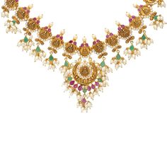 This dazzling 22k yellow gold necklace from Virani Jewelers features engravings on Goddess Lakshmi along with vibrant emeralds, rubies, and pearls. Features: • 22k yellow gold • Goddess Lakshmi imagery • Rubies • Pearls • EmeraldsVirani Jewelers temple jewelry made from 22k gold and precious gemstones brings together the beauty and significance of Indian culture and traditions. Find more beautiful 22k gold temple jewelry like this guddusapulu necklace on our website. Specifications: • Minimum Ne Gold Goddess, Indian Culture And Tradition, Gold Temple Jewellery, Temple Jewelry, Yellow Gold Necklace, Goddess Lakshmi, Indian Culture, Temple Jewellery, Precious Gemstones