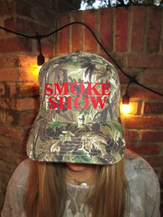 SMOKESHOW TRUCKER HAT  You should also check out our other listing where you can customize your Smoke Show hat! Details:  Camo Otto Trucker Hat *adjustable snapback* Red vinyl  Shipping: We ship PRIORITY so you can get your hat FAST  Let me know if you have any questions :) Trucker Hat Country, Camo Trucker Hat, Bridal Shower Themes, Camo Hat, Hunting Camo, Red Vinyl, Camo Fashion, Camo Hats, Hat Custom