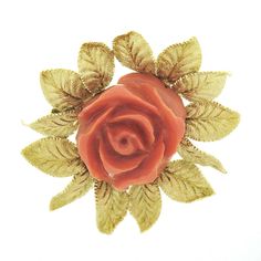 "This large and very well-made vintage brooch was crafted from solid 18k yellow gold. It features a beautiful, GIA certified, natural coral set into an incredibly detailed and textured leaf border frame. The coral is a reddish-orange color and is masterfully carved into a naturalistic, fully bloomed, rose flower shape with very high relief. GIA has certified this stone as being 100% natural with no indications of dye. The leaf border brings a truly elegant look to this piece with unbelievable an Formal Gold Brooch With Rose Design, Coral Rose Necklace, Victorian Gold Flower Brooch, Gold Flower-shaped Brooch With Handmade Flowers, Vintage Gold Carved Brooches, Vintage Gold Flower Shaped Brooch, Leaf Border, Natural Coral, High Relief