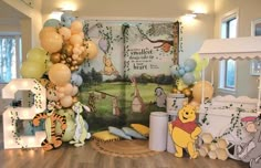 winnie the pooh birthday party with balloons and decorations