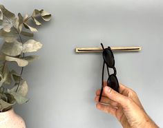 PRICES MAY VARY. ❤️【Easy installation】: Our sunglass holder for the wall is designed for easy assembly. No need to be a handyman, simply attach the holder to the wall using the strong adhesive strip on the back. Within minutes, you can have a convenient and organized storage solution for your sunglasses or eyeglasses. ❤️【Secure and accessible】: Tired of constantly searching for your glasses? With our sunglass holder, you'll always know where to find them. The holder provides a fixed location for Sunglass Rack, Sustainable Sunglasses, Sunglasses Organizer, Glasses Storage, Dog With Glasses, Nose Shapes, Glasses Holder, Wooden Sunglasses, Sunglass Holder