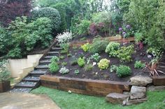 an outdoor garden with steps leading up to it