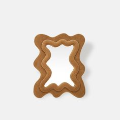 a cookie shaped like a frame on a white surface with the shape cut out to look like