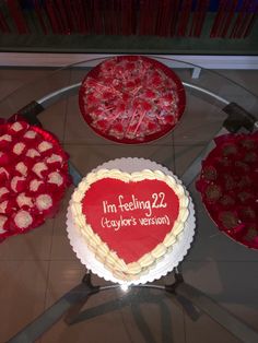 a heart shaped cake sitting on top of a table