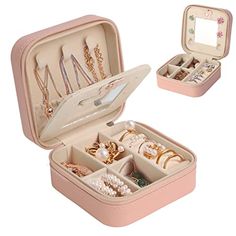 an open pink suitcase with jewelry in it