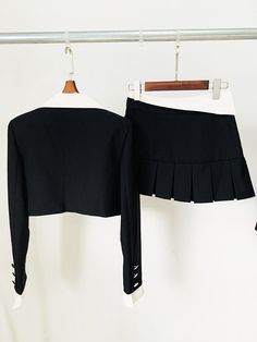 Experience the ultimate in style with this women's crop jacket and mini skirt set. The single button closure, trendy notched collar, and charming pleated mini skirt create a fashion-forward ensemble. Crafted from high-quality polyester, it guarantees both comfort and a chic look, making it perfect for the summer season. Stay effortlessly on-trend with this must-have two-piece set.Specifications Style: High Street Sleeve Style: Regular Sleeve Length(cm): Full Silhouette: Pleated Season: Summer Place Of Origin: China (Mainland) Pattern Type: Solid Pant Closure Type: Zipper Fly Origin: Mainland China Model Number: TS161 Material Composition: Natural fiber Material: Polyester Gender: WOMEN Fabric content: 81% (inclusive) - 90% (inclusive) Fabric Type: Polyester Cotton Dresses Length: Above Kne Pleated Sets For Spring, Chic Mini Skirt Sets For Fall, Chic Fall Sets With Mini Skirt, Fitted Two-piece Long Sleeve Blazer, Fitted Mini Skirt With Fake Two-piece Design, Fitted Mini Skirt With Fake Two-piece Detail, Fitted Fake Two-piece Mini Skirt, Spring Fitted Skirt Suit With Pleated Skirt, Fitted Mini Length Skirt With Fake Two-piece Detail