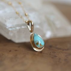 Our new LBJ Drop of Gold Pendant is a Solid Gold - 14K and 18K Gold Hubei Turquoise Pendant Necklace. One of a Kind and Ready to Ship Teardrop Turquoise Gold Necklace. You will receive the exact Hubei Turquoise Pera Shaped Gold Pendant in the Photos. Stunning alone, stacked or worn as a charm. The term dripping with gold comes to mind ... fabricated with 14K solid gold sheet and bail and 18K solid Gold bezel, this gorgeous, earthy, pear-shaped Hubei Turquoise cabochon is a solid gold drop of sun Formal Teardrop Turquoise Jewelry, Formal Turquoise Teardrop Jewelry, Heirloom Turquoise Necklace As Gift, Heirloom Turquoise Necklace For Gift, Turquoise Gemstone Necklace For Anniversary, Anniversary Turquoise Gemstone Necklace, Fossil Ring, Hubei Turquoise, Gold Sheets