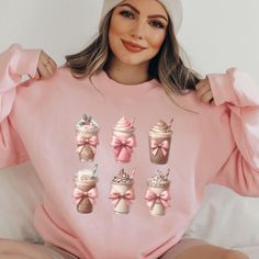 Celebrate the season in style with our Coquette Christmas Coffee Sweatshirt! Perfect for the trendy mom who loves her iced coffee, this Xmas bow-adorned latte top makes a cozy holiday gift. Ideal for any coffee lover, this sweater is a must-have for festive mornings! 🎀 Please make sure to place your order before December 7th to receive your item before Christmas 🎄🎁 Explore our Christmas collection here: https://bit.ly/ChicChristmasGifts 👕 YOUR NEW SWEATSHIRT Our Gildan 18000 sweatshirts are Cute Long Sleeve Tops As Gift, Cute Long Sleeve Tops As A Gift, Cute Winter Tops As Gift, Cute Winter Tops As A Gift, Coffee Sweatshirt, Trendy Mom, Mom Coffee, Holiday Sweater, Christmas Coffee