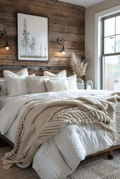 a bed with white comforter and pillows in front of a wooden headboard on the wall