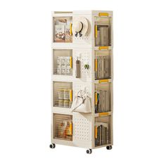 a white bookcase with several compartments on wheels