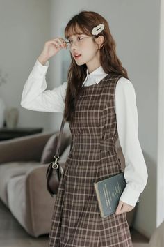 Round neck sleeveless plaid midi dress with thick shoulder straps in an all-over plaid print. Zips up at the back with a tie-waist and side pockets. Perfect for layering with your favorite blouse or sweater. S: 35" chest, 29" waist, 41.5" lengthM: 36.5" chest, 30.5" waist, 41.5" lengthL: 38" chest, 32" waist, 41.5" length Brown Plaid Dress Outfit, Casual Midi-length Plaid Dress For Day Out, Chic Midi-length Plaid Dress For Fall, Brown Plaid Shirt Dress, Brown Plaid Pinafore Dress, Shoe Gifts, Overall Dress, Sweater Blouse, Cardigan Jacket