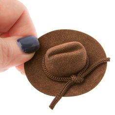 Mini Brown Flocked Cowboy Hat. This Mini Brown Flocked Cowboy Hat is a darling accessory fit for a western look! The small cowboy hat makes for a darling placeholder or favor for western-themed parties, barbecues, and weddings. Utilize it as a gift package decoration for those friend and family cowboys, western lovers, and horse lovers!    This precious hat is covered in rich velveteen coating and its crown is detailed with matching shiny rope trim. Stuffed Gnomes, Cowboys Western, Package Decoration, Mini Cowboy Hat, Sombrero Cowboy, Brown Cowboy Hat, Doll Hats, Diy Plastic Bottle, Western Theme Party