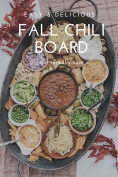 a platter filled with different types of food and the words fall chili board on it