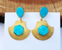 "2.51\" Long Turquoise Pear & Hexagon Earrings / Bollywood Designer Earrings / Gemstone Gold Earrings / Ethnic Tribal OOAK Earrings. Gemstones: Turquoise Metal : 22kt Gold Plated Brass Earrings Length : 64mm or 2.51\" long by 44mm or 1.73\" wide approx Stone size:- Pear - 19x16 mm approx Hexagon - 18x18 mm approx Click here to check more of our one of a kind earrings:- https://www.etsy.com/in-en/shop/RareGemsNJewels/items?ref=pagination&search_query=ooak+earrings -------------------------------- Hexagon Earrings, Bezel Set Earrings, Carnelian Jewelry, Turquoise Howlite, Bohemian Earrings, Copper Pendants, Gold Drop Earrings, Gorgeous Earrings, Turquoise Earrings