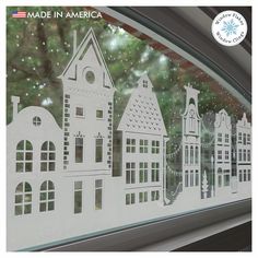 an image of a window with buildings drawn on it