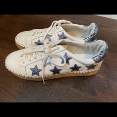 White Sneaker/Espadrille With Sparkly Stars. Have Only Been Worn Once And Look Brand New! These Sneakers Are Very Comfortable And Look Amazing With Every Outfit! They Are Trendy And Are So Cute! They Go With Every Outfit Since They Are White, And They Have A Pop Of Color With The Silver/Blue Stars!!! Casual Low-top Espadrilles With Contrast Sole, Trendy Espadrilles With Rubber Sole, White Low-top Espadrilles With Rubber Sole, Trendy White Round Toe Espadrilles, Blue Stars, Trendy Sneakers, Marc Fisher, Blue Star, Silver Blue