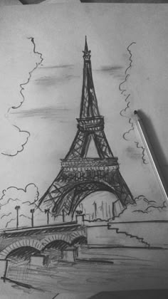 a drawing of the eiffel tower in paris, france with a pencil on paper