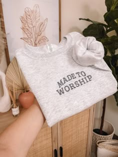 "Embroidered Minimalistic Made To Worship Sweatshirt. Embroidery size: approximately 5\" in length (across chest) Sizes: UNISEX Small, Medium, Large, XLarge, 2Xlarge -Fit is a little loose Color: Ash Thread: Frost  Wash & Care: -Wash in cold water with like colors on a gentle cycle -Tumble dry low or hang to dry PROCESSING/TURNAROUND TIME: -Processing/Turn around times may vary. Please check the estimated ship/delivery times.  -Processing/Turn around time DOES NOT include shipping time. *PLEASE Gray Embroidered Sweatshirt, Made To Worship Sweatshirt, Bridesmaid Embroidery Gifts, Made To Worship Shirt, Christian Embroidery Designs Shirt, Elevation Worship Outfits, Worship Sweatshirt, Christian Small Business, Jesus Merch