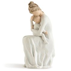 a ceramic figurine of a woman sitting on a rock with her hands behind her head