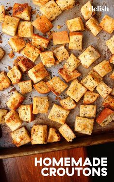 homemade croutons on a baking sheet with text overlay that reads, homemade croutons