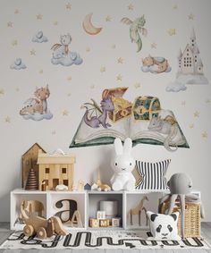 a child's room with toys, books and wall decals on the walls