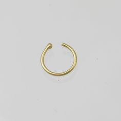 Handcrafted nose hoops in your choice of 14k yellow gold, rose gold, or white gold. (Solid Gold, not plated or filled). Hoop has a ball on one end to help secure in place. Measures about 9mm in diameter. 20 gauge Can be made with any gauge and diameter, feel free to request a price quote! Hypoallergenic 14k Gold Septum Ring, Minimalist 14k Gold Hoop Piercings, Gold Stackable Septum Ring For Everyday, Minimalist Internally Threaded Yellow Gold Septum Ring, Gold Sterling Silver Hoop Nose Rings, Adjustable 14k Gold Septum Ring, Minimalist Round Septum Ring For Everyday, Adjustable Minimalist Huggie Septum Ring, Adjustable Small Hoop Septum Ring For Everyday