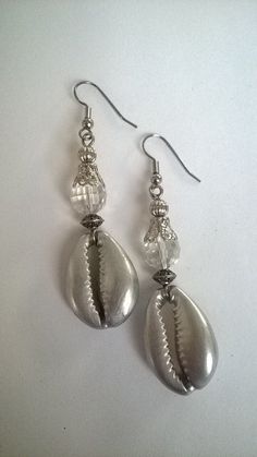 Classy Cowie Shell Earrings. A classy twist on a old favorite. Comes in Black, Sliver with Brass or Silver metal  accents. 2 inches long and can be converted to clip please note in order. Nickel Free Silver Plug Earrings For Parties, Nickel-free Silver Plug Earrings For Parties, Nickel Free Silver Teardrop Clip-on Earrings, Silver Teardrop Metal Clip-on Earrings, Nickel-free Silver Teardrop Clip-on Earrings, Silver Teardrop Nickel-free Clip-on Earrings, Silver Teardrop Earrings For Beach, Silver Metal Beach Jewelry, Silver Metal Jewelry For The Beach