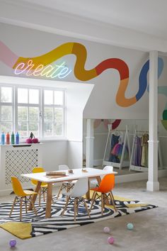 a room with white walls and colorful furniture