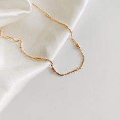 Our Block Chain necklace is both subtle and delicate.  Crafted from 18k Gold Filled and detailed with a beautiful block chain design, this piece is the perfect balance of luxurious and effortless. It's the perfect everyday piece.  ∙ D E T A I L S ∙ - 18k Gold Filled Chain - 16, 18, or 20" Length Options -  Hypoallergenic (lead + nickel free) ∙ G O L D ∙ F I L L E D ∙ Gold-filled components contain 100+ times more real gold than gold-plated components and are both durable and tarnish resistant. I Dainty 14k Gold-filled Chain Necklace, Dainty 14k Gold-filled Necklaces With Adjustable Chain, Dainty 14k Gold-filled Yellow Gold Chain Necklace, Dainty Yellow Gold Tarnish-resistant Chain Necklace, Delicate 14k Gold-filled Tarnish Resistant Chain Necklace, Block Chain, Gold Necklace Layered, Minimalist Necklace, Custom Cards