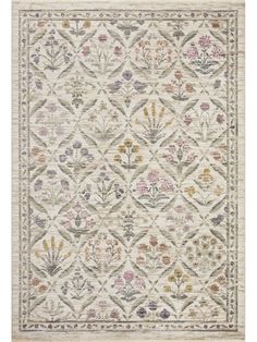 an area rug with various flowers and leaves on the side, in neutral colors is shown