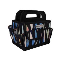 a black and multicolored bag with handles on the front, featuring an abstract design