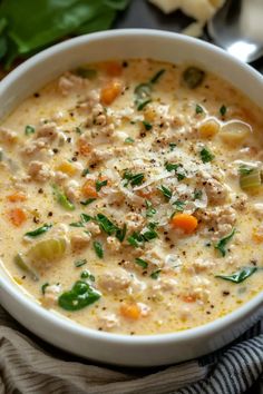 a white bowl filled with soup on top of a table