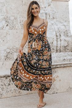 Black Retro Boho Floral Tassel Tie Maxi Dress Black Bohemian V-neck Sundress, Black Boho Dress With Print For Vacation, Black Bohemian Dress With Loose Fit, Black Flowy Boho Dress, Black Flowy Bohemian Dress, Black Bohemian Dress With Boho Print, Black Boho Print Maxi Dress, Black Bohemian Sundress For Vacation, Black Flowy Boho Dress For Festival