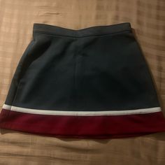 Excellent Condition Skirt By Varsity No Shell, Sadly. Skirt Only Measures 14” Across But Has The Usual Second Button To Go Up A Size Or So About 14.5” Long Grey Red And White In Color Cheer Uni Cheerleading Cheerleader Sporty Red Fitted Skirt, Cheerleading Mini Skort With Lined Skirt, Preppy Red Mini Skirt, Varsity White Tops For Cheerleading, Cheerleading Mini Skirt With Lined Details, Red Mini Tennis Skirt For School, Mini Skirt Bottoms With Built-in Shorts For Cheerleading, Fitted Mini Skirt With Built-in Shorts For Cheerleading, Cheerleading Skirt With Built-in Shorts