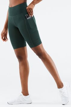 High-Waisted SculptKnit® Pocket Short Fabletics green female Activewear >> Womens >> Bottoms >> Shorts SculptKnit regular Training Breathable/Chafe-Resistant/Moisture-Wicking/Pockets Green Functional Activewear With Elastic Waistband, Versatile Green Activewear For Loungewear, Green High Stretch Short Activewear, Green Compression Sportswear Bottoms, Green Sporty Bottoms With Ribbed Waistband, Sporty Green Bottoms With Ribbed Waistband, Green Activewear With Elastic Waistband For Training, Green Sporty Activewear With Pockets, Green Sports Bottoms With Ribbed Waistband