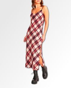 A bold plaid print patterns an eye-catching dress fashioned with adjustable spaghetti straps and a stem-baring side slit. V-neck Sleeveless 100% polyester Hand wash, dry flat Imported SIZE INFO True to size. XS=0, S=2-4, M=6-8, L=10-12, XL=14. Veronica Lodge Outfits, Plaid Slip Dress, Purple Midi Dress, Lace Dress Black, Pink Midi Dress, Satin Slip, Satin Slip Dress, Knit Mini Dress, Bb Dakota