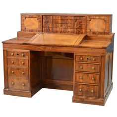 an old fashioned wooden desk with drawers