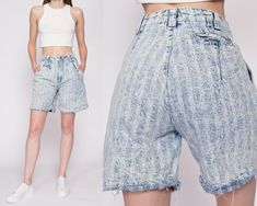 "Vintage 80s acid wash striped jean shorts, with a high waist, pleating at the front, and cutoff legs. Measurements and Condition:    Fits like: Labeled size 7/8, fits modern women's extra small Fabric: Cotton denim Brand: Tarazzia Sport Condition: Very good, with light general wear, and some fraying at the button hole but it still works fine,.   Waist: 25\" Hips: 38\" - taken at the bottom of the zipper opening Rise: 12\" Inseam: 7\" Shown on a 5'9\" model with measurements of 33\"-24\"-37\", u 90s Acid Wash Bottoms For Spring, Acid Wash High Rise Relaxed Fit Bottoms, Retro Cutoff Shorts For Spring, High Rise Acid Wash Relaxed Fit Bottoms, Spring Retro Cutoff Shorts, Retro Washed Bottoms For Spring, Retro Distressed Bottoms For Spring, Spring Retro Distressed Bottoms, 90s Style Washed Bottoms With Relaxed Fit