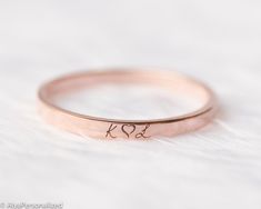 Minimalist wedding band , womens wedding band engraved with your desired initials symbols or words... 14k solid rose gold ring will stay with you forever in same condition.Express your unique and elegant style with your wedding band ♡ Also makes a perfect personalized gift for her...We design this engraved ring as a simple but stylish piece which can match perfectly with other jewelry. Please let us know if you want any custom requests for this wedding ring. ► FEATURES; Band width: 2mm Material Wedding Initial Ring With Round Band, Elegant Stackable Wedding Rings With Initials, Minimalist Stackable Wedding Rings With Initials, 14k Gold Hand Stamped Wedding Rings, Hand Stamped 14k Gold Wedding Rings, Wedding 14k Gold Stackable Initial Ring, Wedding Stackable Initial Ring In 14k Gold, Rose Gold Engraved Wedding Ring, Round Band, Rose Gold Sterling Silver Initial Ring For Wedding