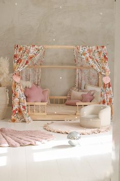 a living room filled with furniture and flowers on the curtains over the window sill