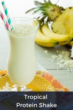 A tropical protein shake sits in fron tof bananas and pineapples. Pineapple Protein Shake, Protein Shake Recipe, Pineapple Chunks, Healthy Protein Snacks, Protein Snack, Protein Shake Recipes, Frozen Pineapple, Protein Recipes