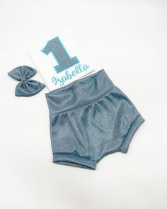 This adorable Chromatic Light Blue Bummies Shorts Outfit themed is perfect for your little one's Bday Party Welcome to BdayFashionBoutique This Beautiful Shimmer Light Blue Bummies Outfit Set is made with knit stretchy fabric.  The Shirt is a Boutique quality shirt with cute puff sleeves that will make your little one look amazing. All of our outfits are made with the best and most high-quality materials possible and with all the love and dedication. Birthday Outfits are the most important part Cute Blue Sets For Birthday, Cute Summer Bottoms For Birthday, Cute Blue Diaper Cover For Playtime, Number Shirt, Shimmer Lights, Birthday Numbers, Girls Clothing Sets, Outfit Set, Birthday Outfit