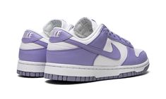 The Women’s Nike Dunk Low Next Nature “Lilac” is a women’s-exclusive colorway of the vintage basketball shoe made from at least 20% recycled content by weight.  The eye-pleasing “Lilac” colorway was released as part of the “Move to Zero” campaign by Nike that aims to reduce the brand’s carbon footprint.  The shoe features a white leather base with Lilac-colored leather overlays and Swoosh branding.  White “Nike” embroidery appears on the heel.  Lilac “Nike” and Swoosh detailing can be found on t Dunks Purple, Purple Low Dunks, Light Purple Dunks, Next Nature Lilac Dunks, Nike Dunks Low Purple, Lilac Shoes, Tenis Nike, Yeezy 350, Nike Dunk Low