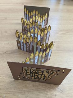 a birthday card made out of pencils on a table