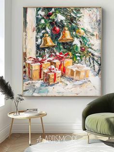 a painting hanging on the wall next to a chair in a room with a christmas tree