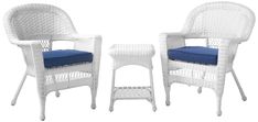 two white wicker chairs with blue cushiones and side table on the left hand side